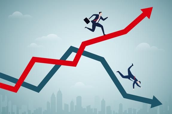 One executive runs up a red rising arrow while another falls along a blue declining arrow, symbolising market winners and losers over a city skyline.